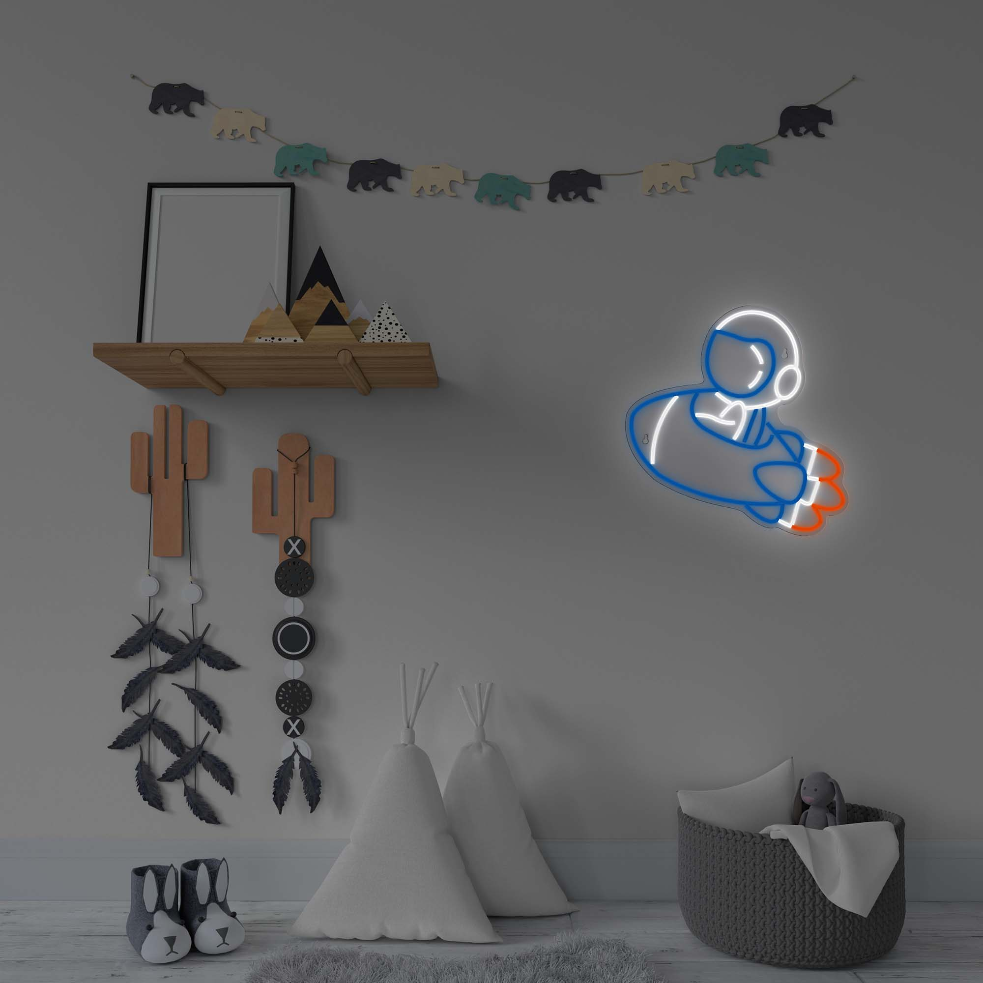 Pokój dziecięcy z neonowym astronautą na ścianie i koszem.