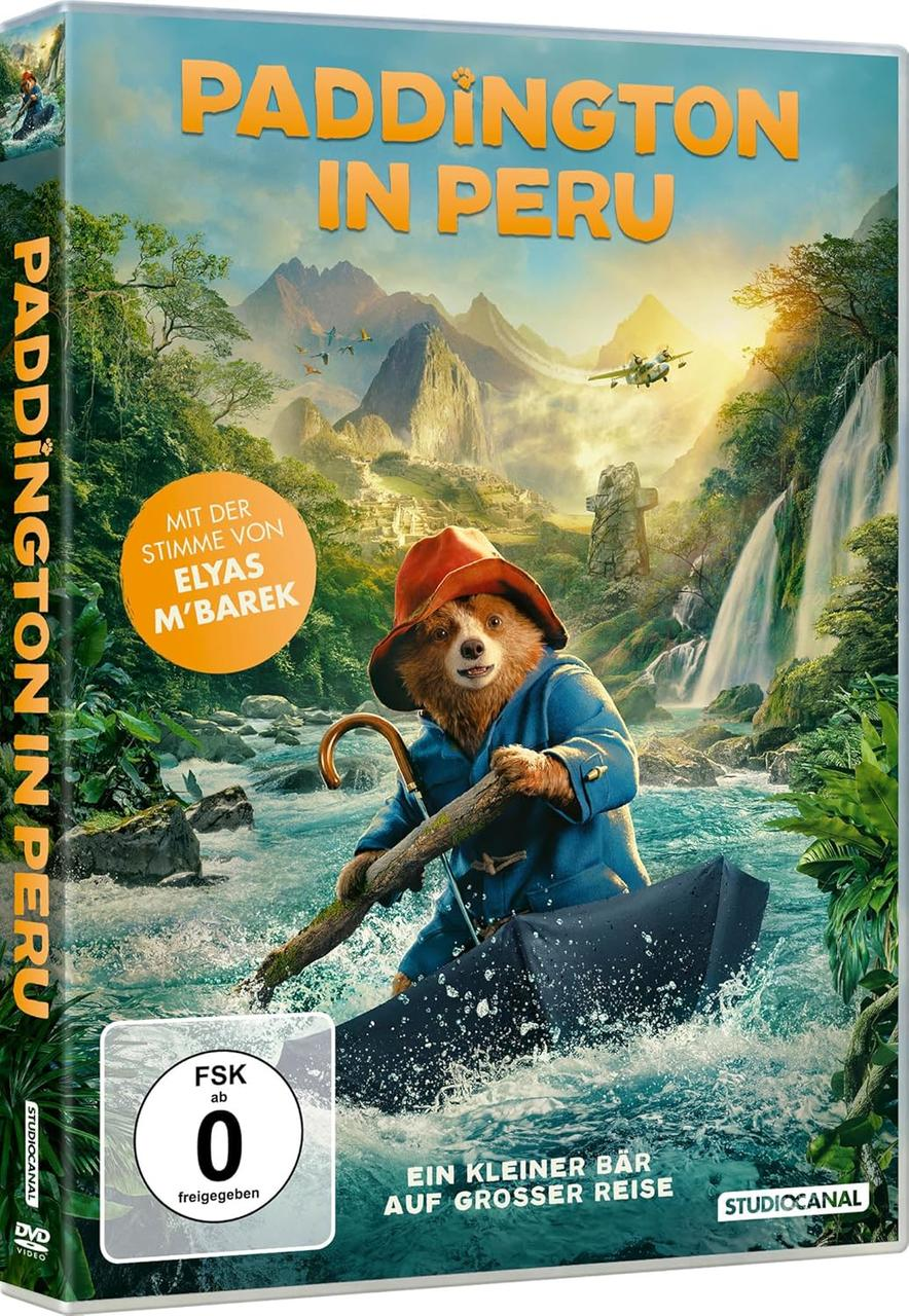 Paddington in Peru DVD-Cover mit dem Bären in einem Boot auf einem Fluss, Bergen und einem Flugzeug im Hintergrund.