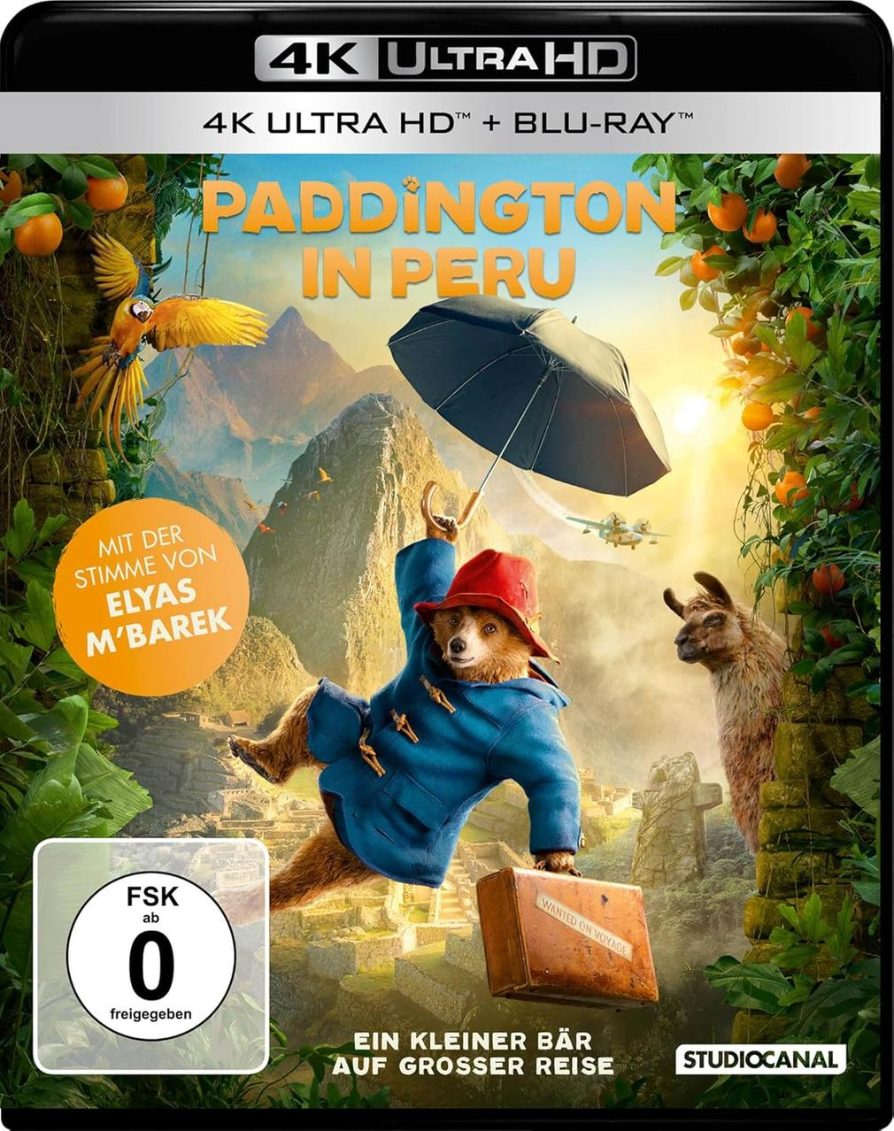 DVD-Cover für 'Paddington in Peru'. Paddington Bär hält einen Regenschirm, mit anderen Charakteren. Bunt.