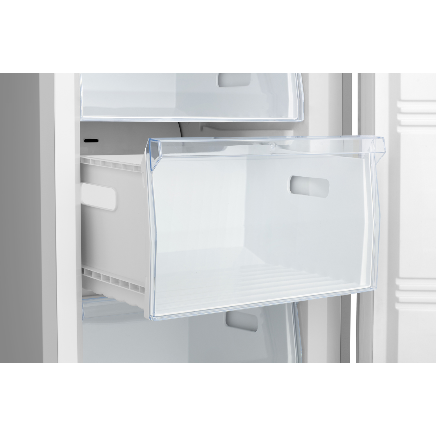 White refrigerator drawer, partially pulled out, inside view.
