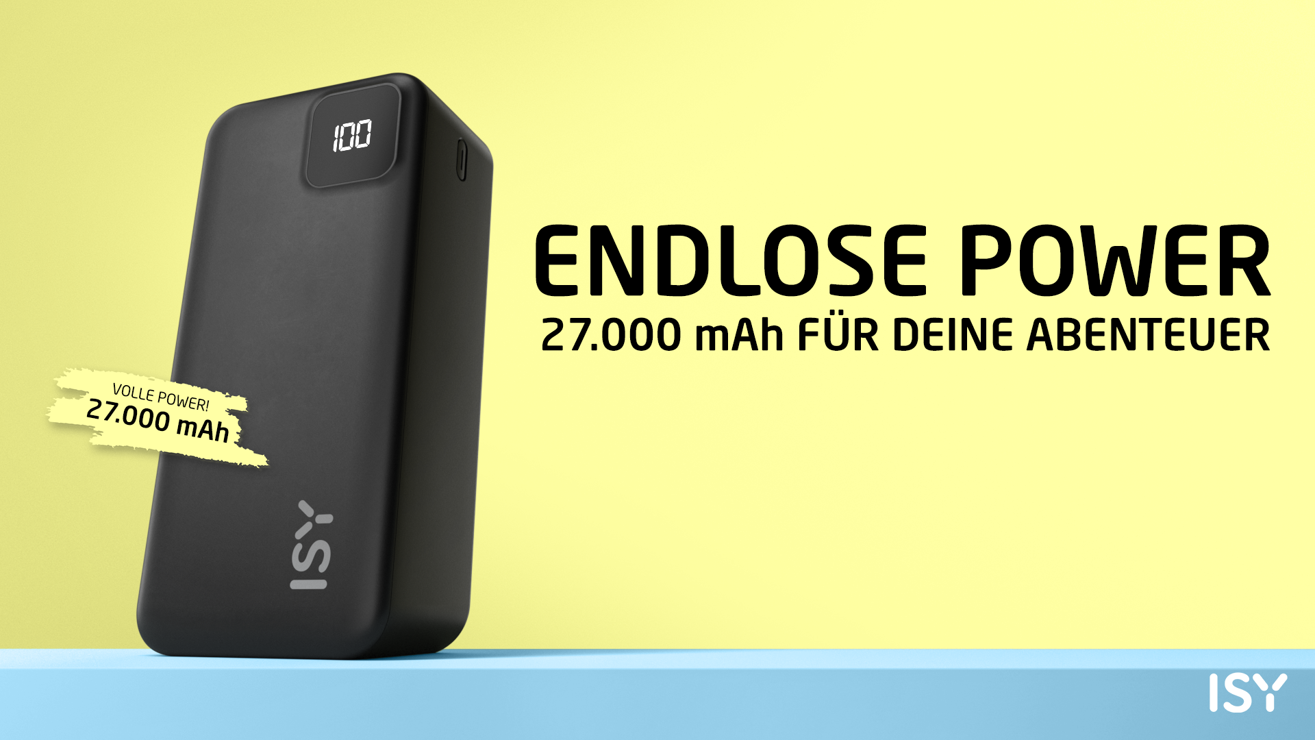 Schwarze Powerbank mit weißem Text und blauer Oberfläche, gelber Hintergrund.