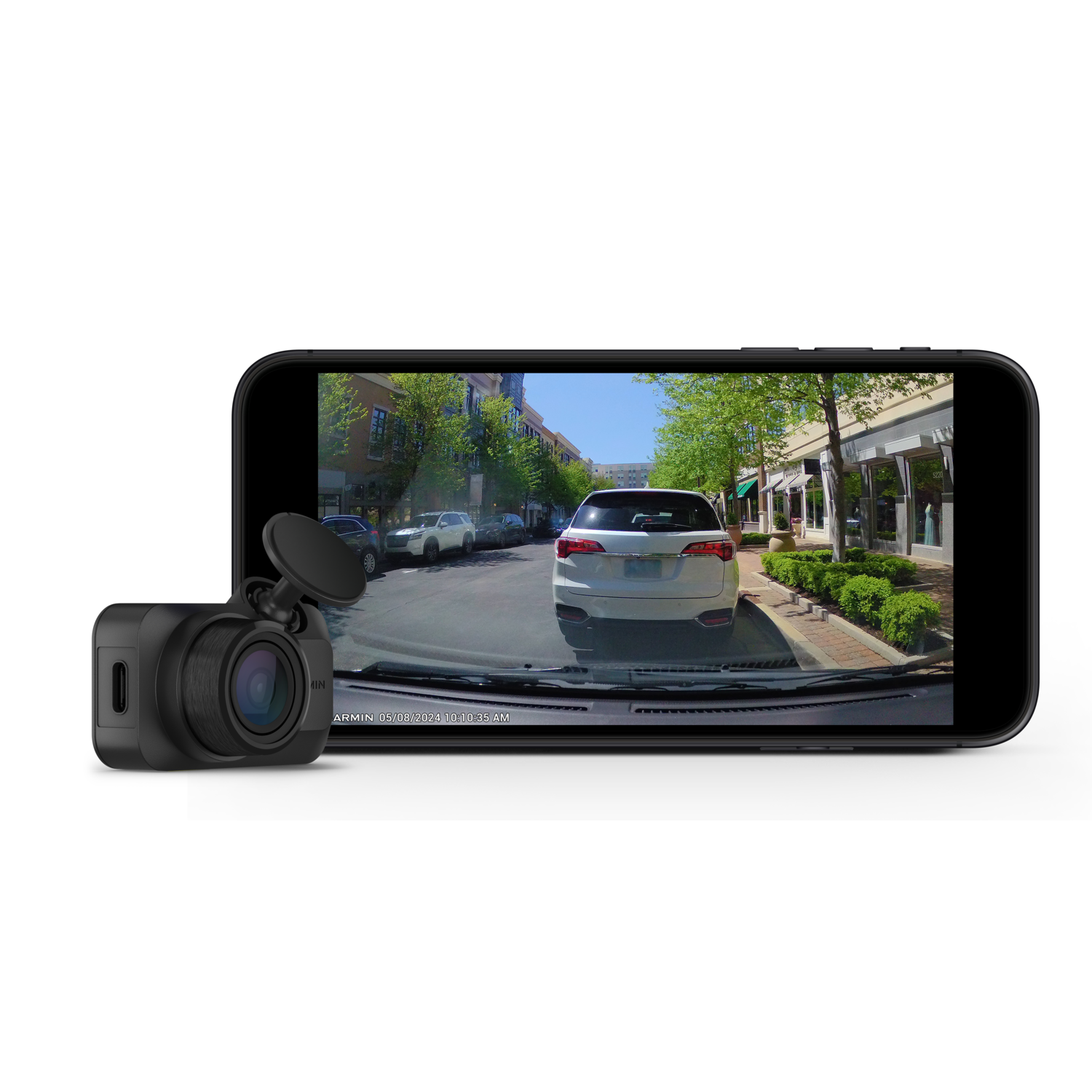 Dashcam op een telefoon die een straatbeeld met een witte auto weergeeft.