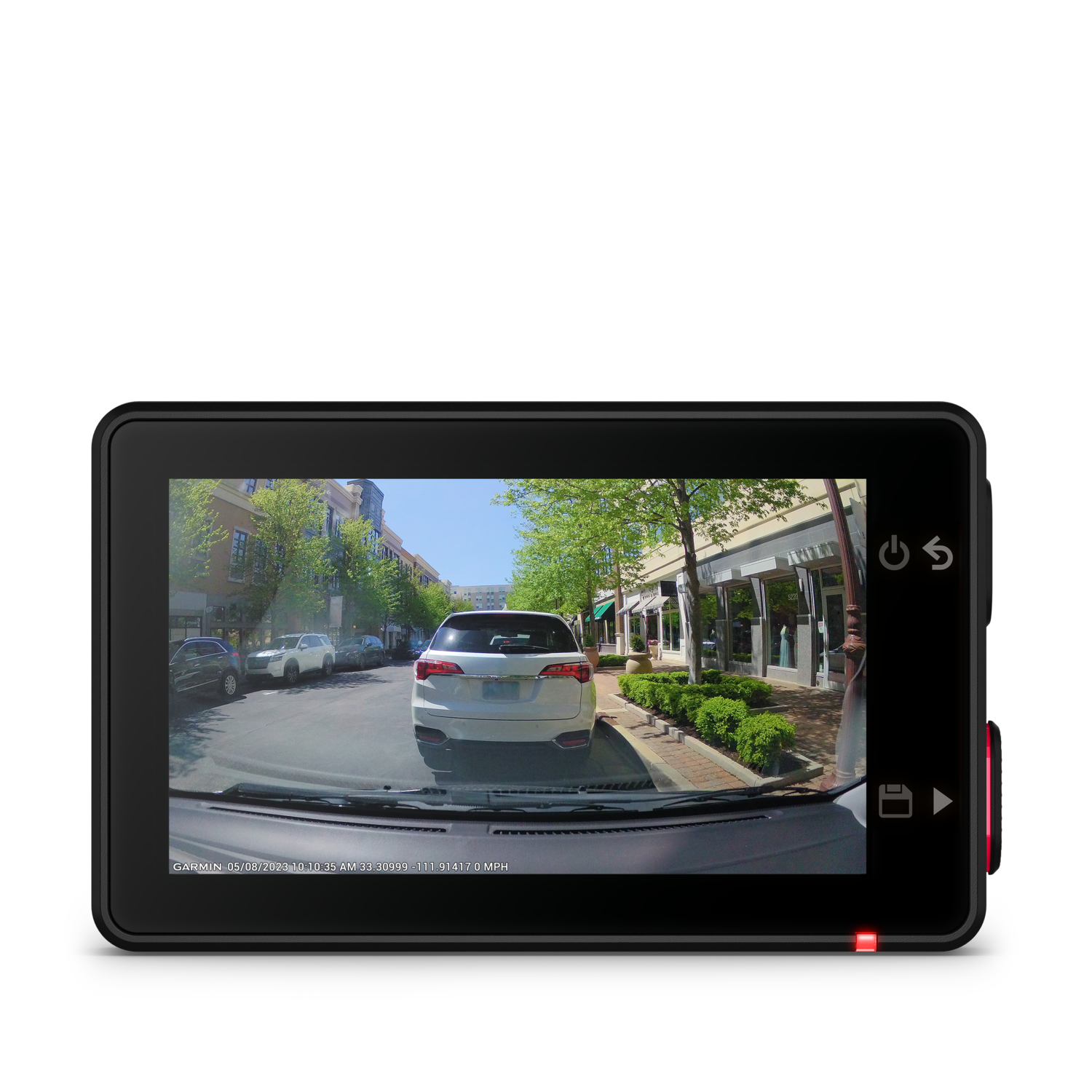 A car dashboard with a dashcam recording a street view.