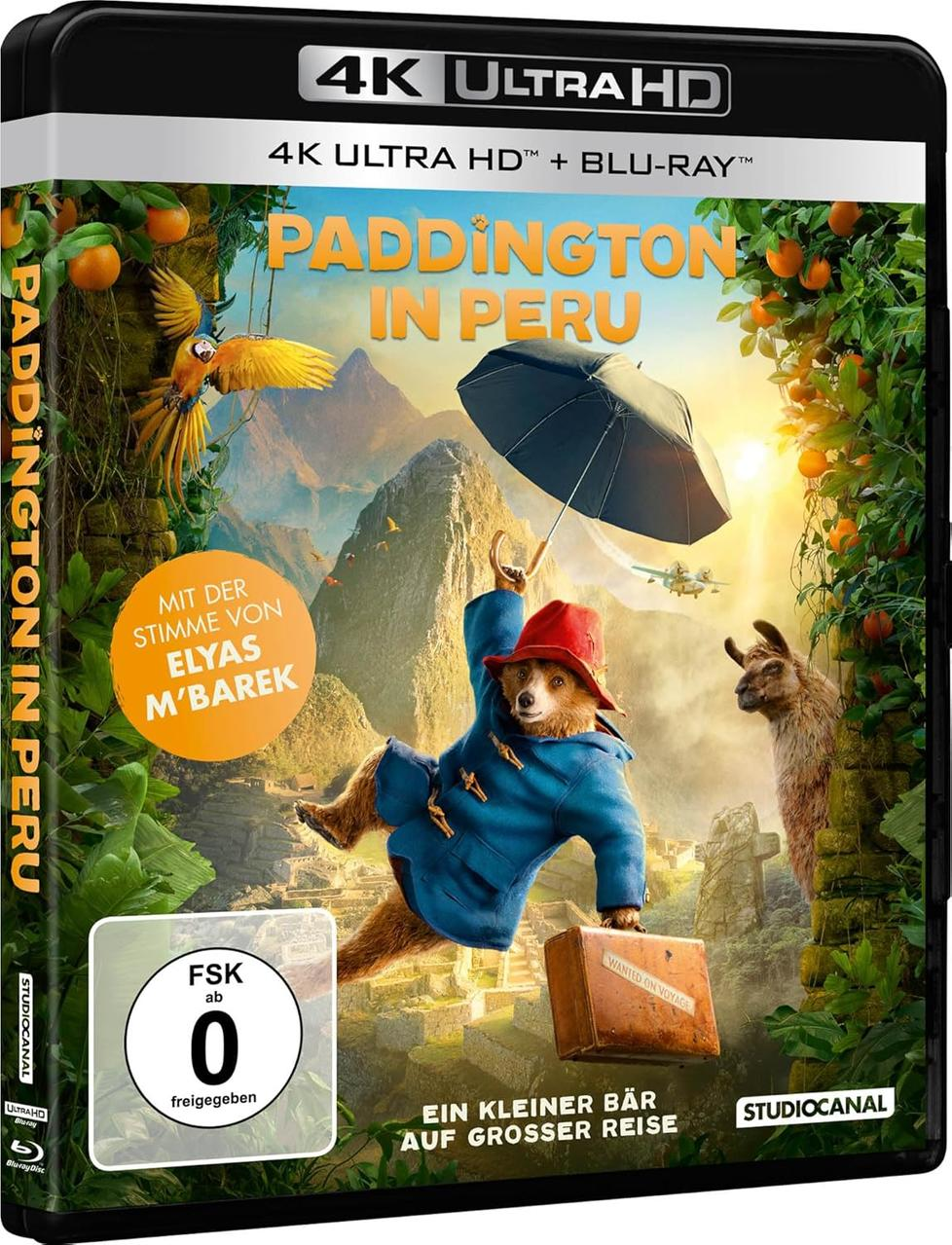 DVD-Box des Films Paddington in Peru, mit dem Bären mit Hut und blauem Mantel, mit farbenfrohem Hintergrund.