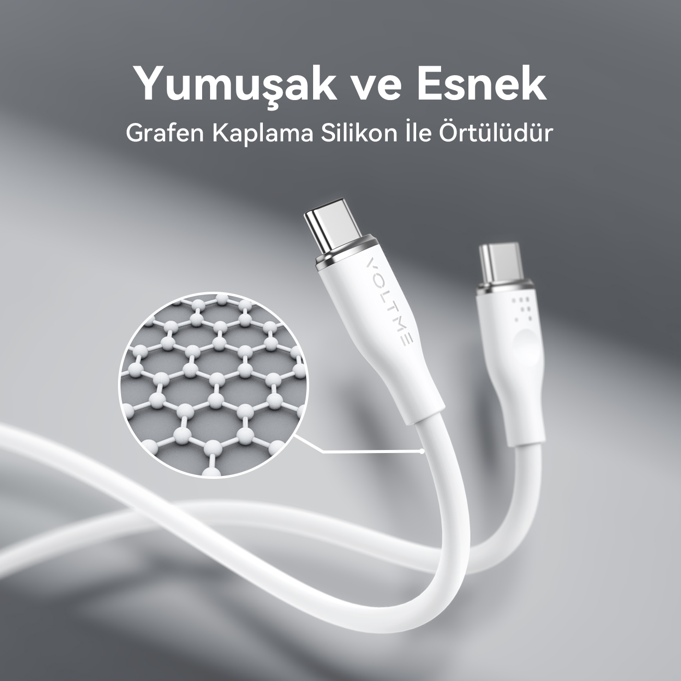Grafen kaplamanın detaylı yakın çekimi, gri arka plan ile beyaz şarj kabloları.