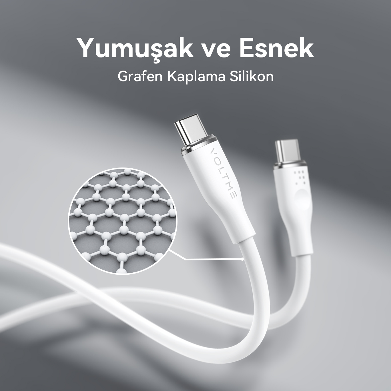 Gri bir arka plan üzerinde, grafen kaplamanın yakın çekimi ile iki beyaz USB-C kablosu.