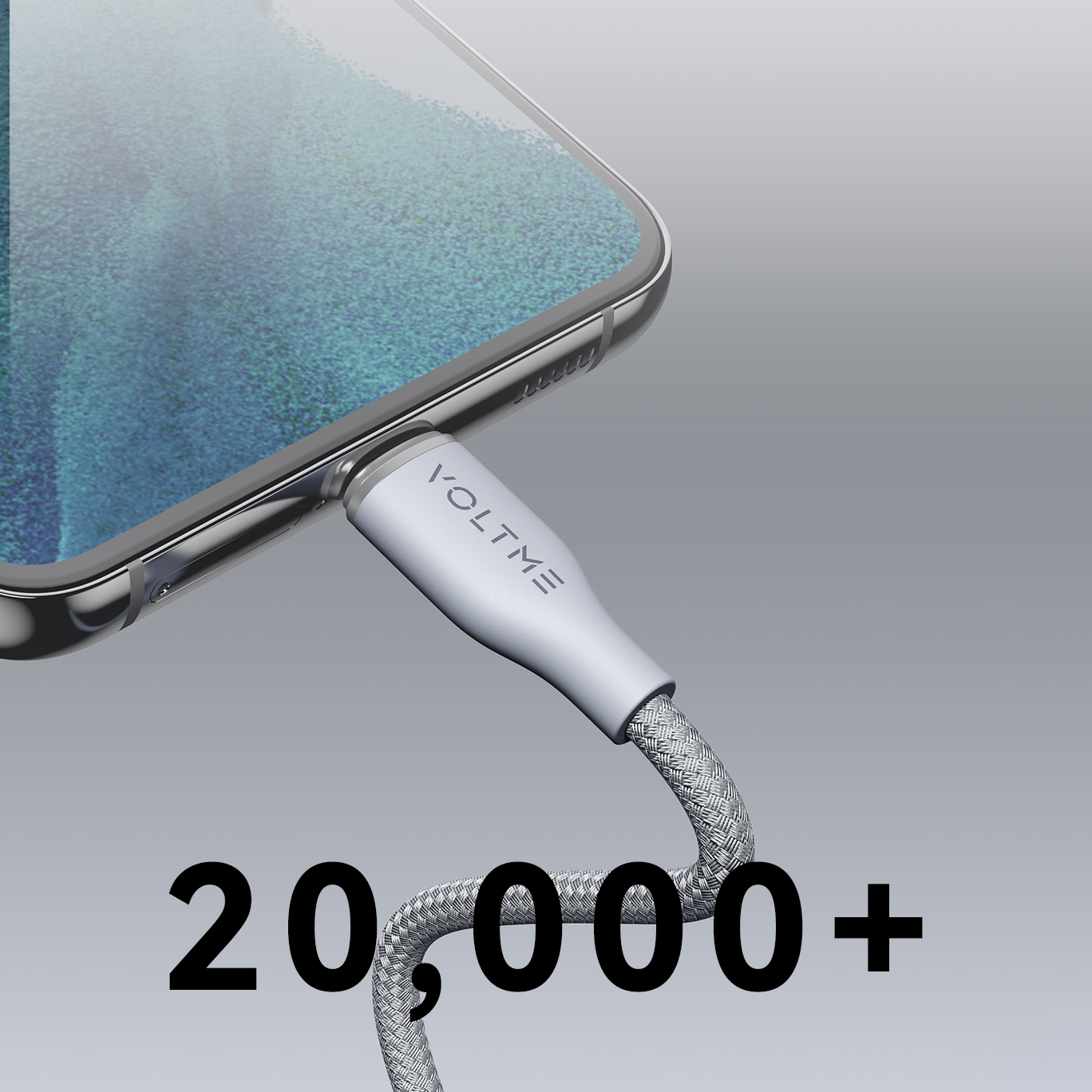 Gri bir USB-C kablosu bir telefona takılı, altında 20.000+ sayısı.