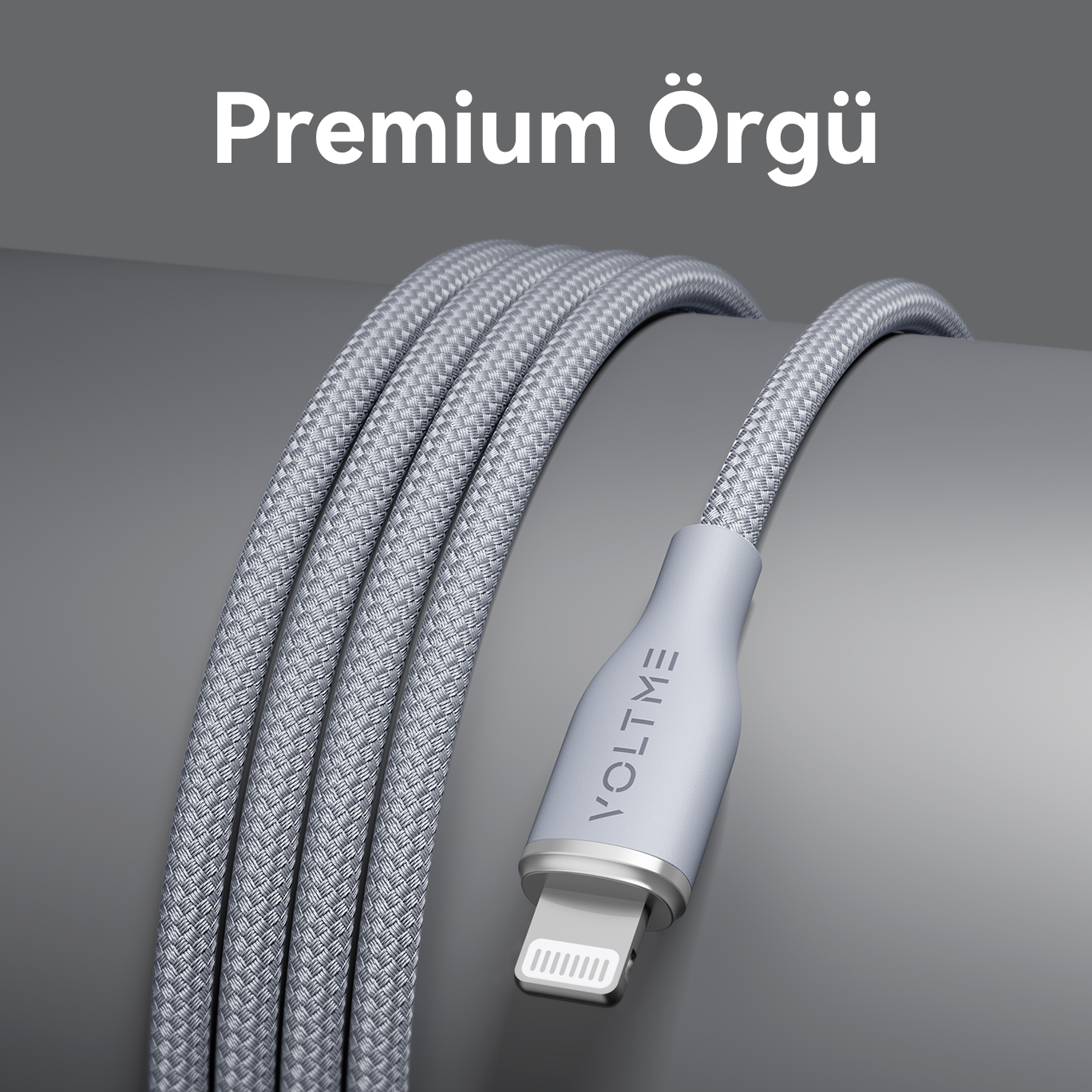 Lightning konektörlü, VOLTME etiketli örgülü gümüş şarj kablosu. Premium Örgü metni.