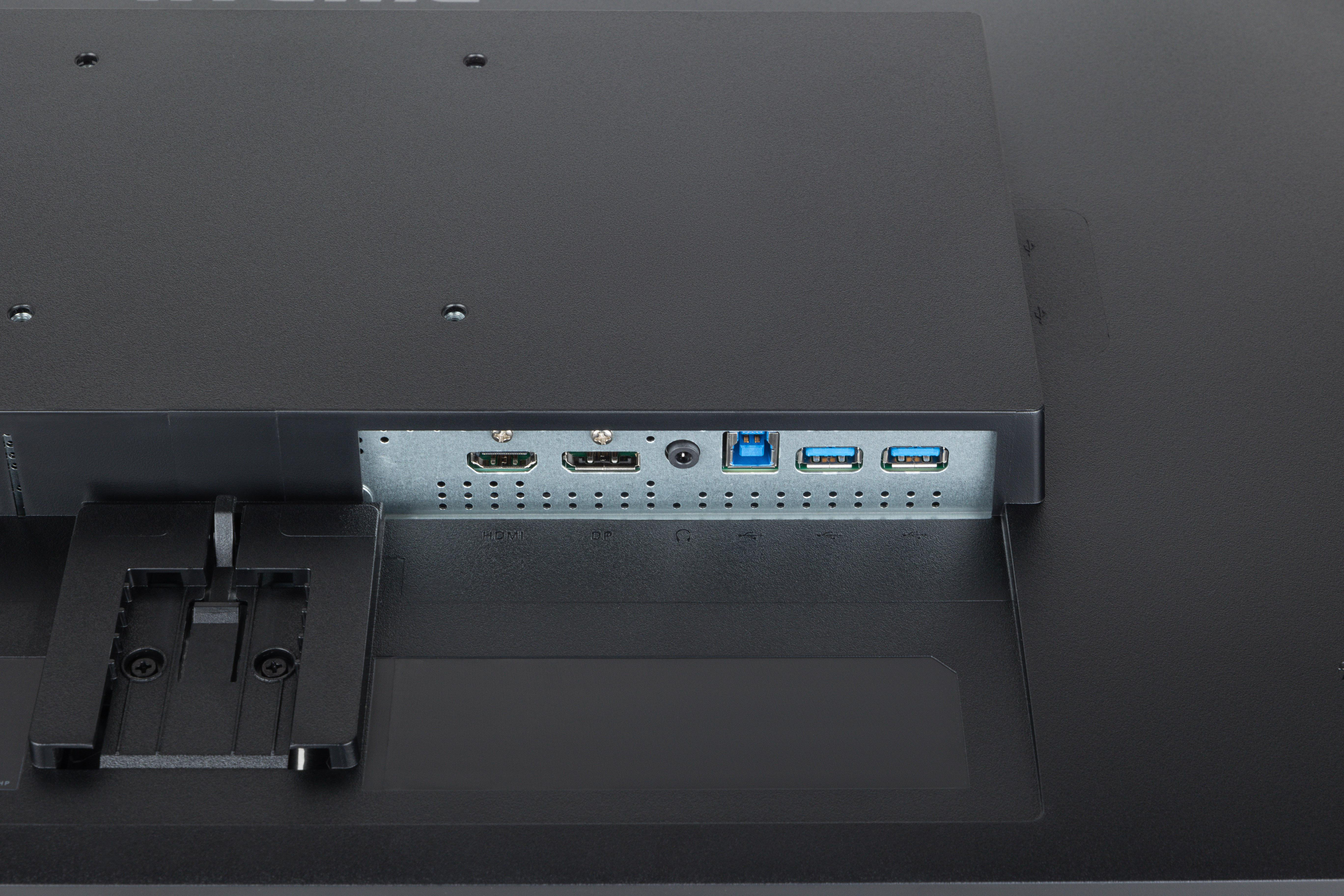 Rückseite eines schwarzen Computermonitors mit Anschlüssen für HDMI, USB und Audio.