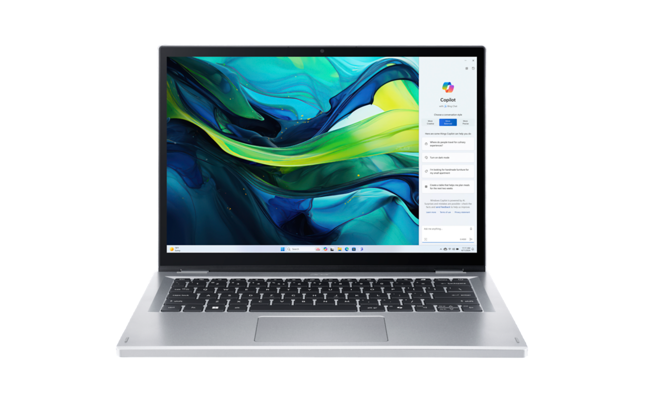 Laptop mit Bildschirm, der eine Copilot-Oberfläche zeigt. Die Tastatur ist sichtbar.