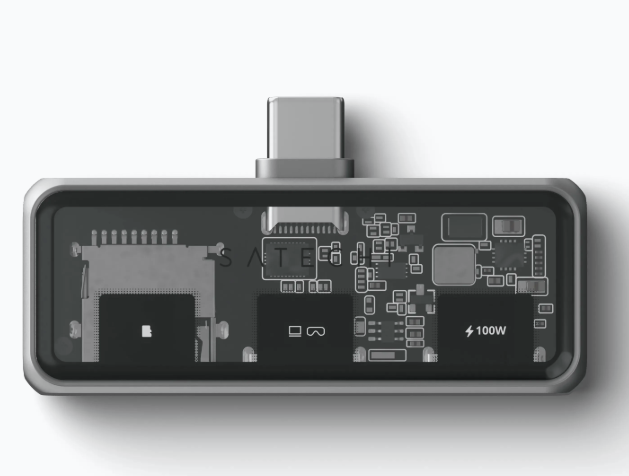 Nahaufnahme eines grauen elektronischen Geräts mit sichtbaren internen Komponenten.