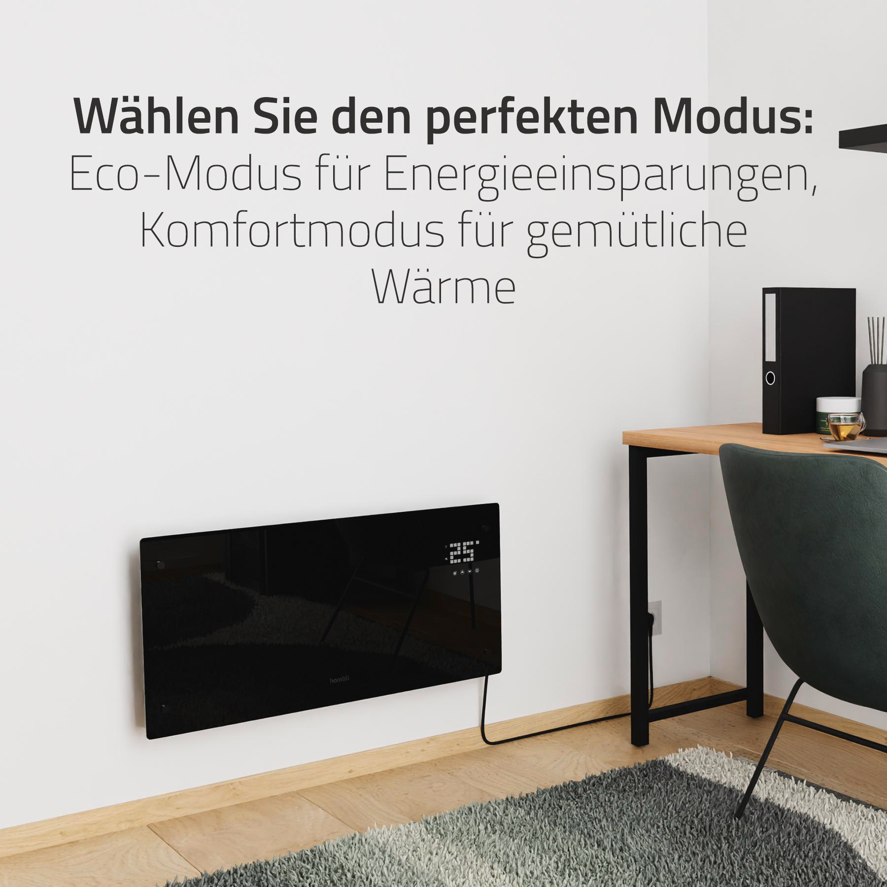 Ein schwarzer Elektroheizer an einer Wand mit Display, in einem Raum mit Schreibtisch.