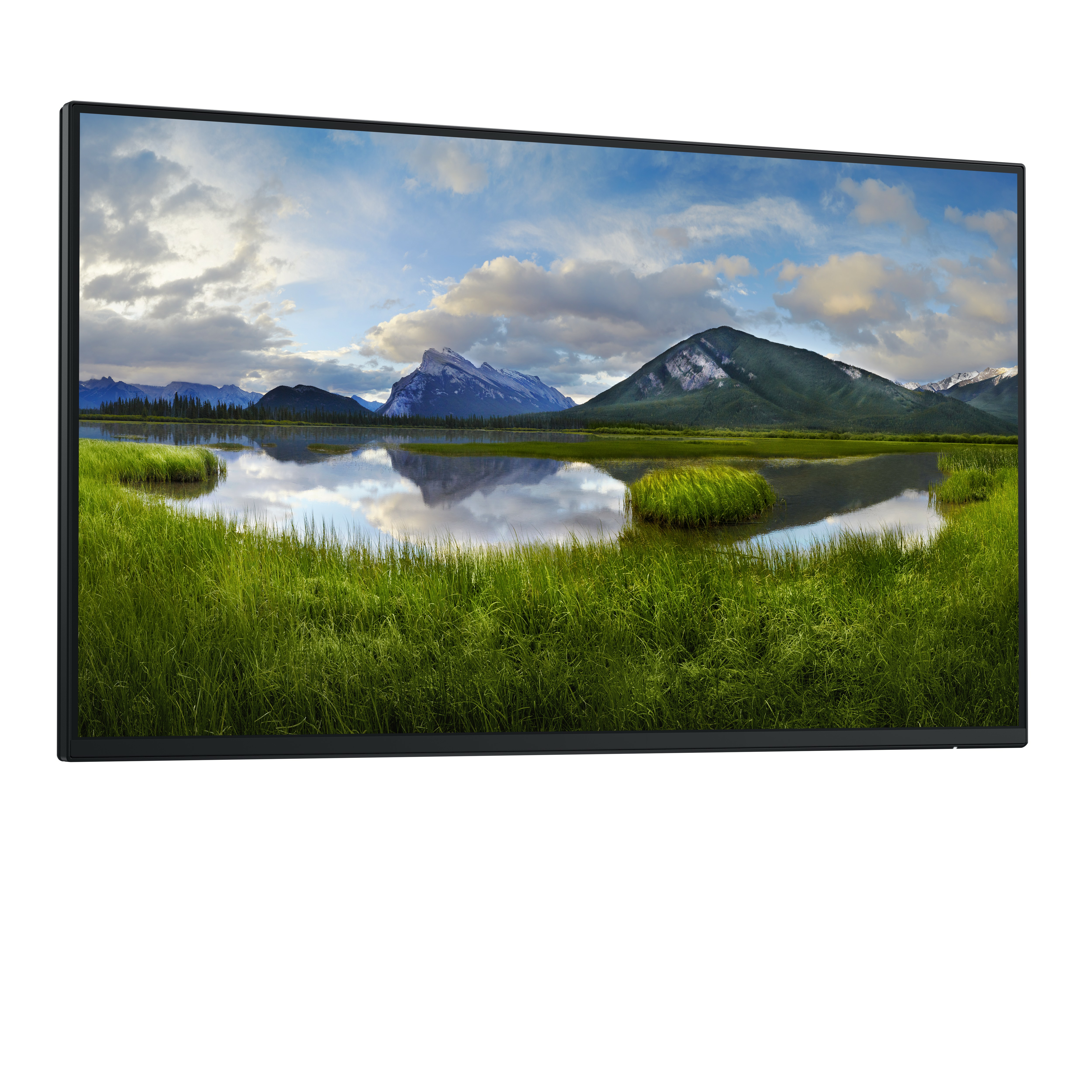 Ein Monitor zeigt eine Landschaft: Berge, See, grasbewachsener Vordergrund unter bewölktem Himmel.