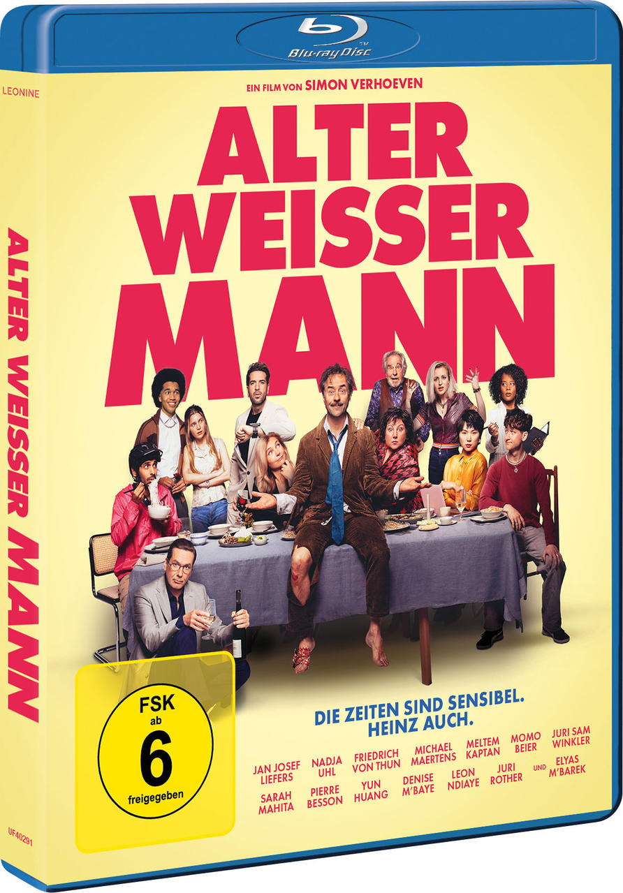 Filmposter von 'Alter Weisser Mann' mit einer Gruppe von Leuten am Tisch.