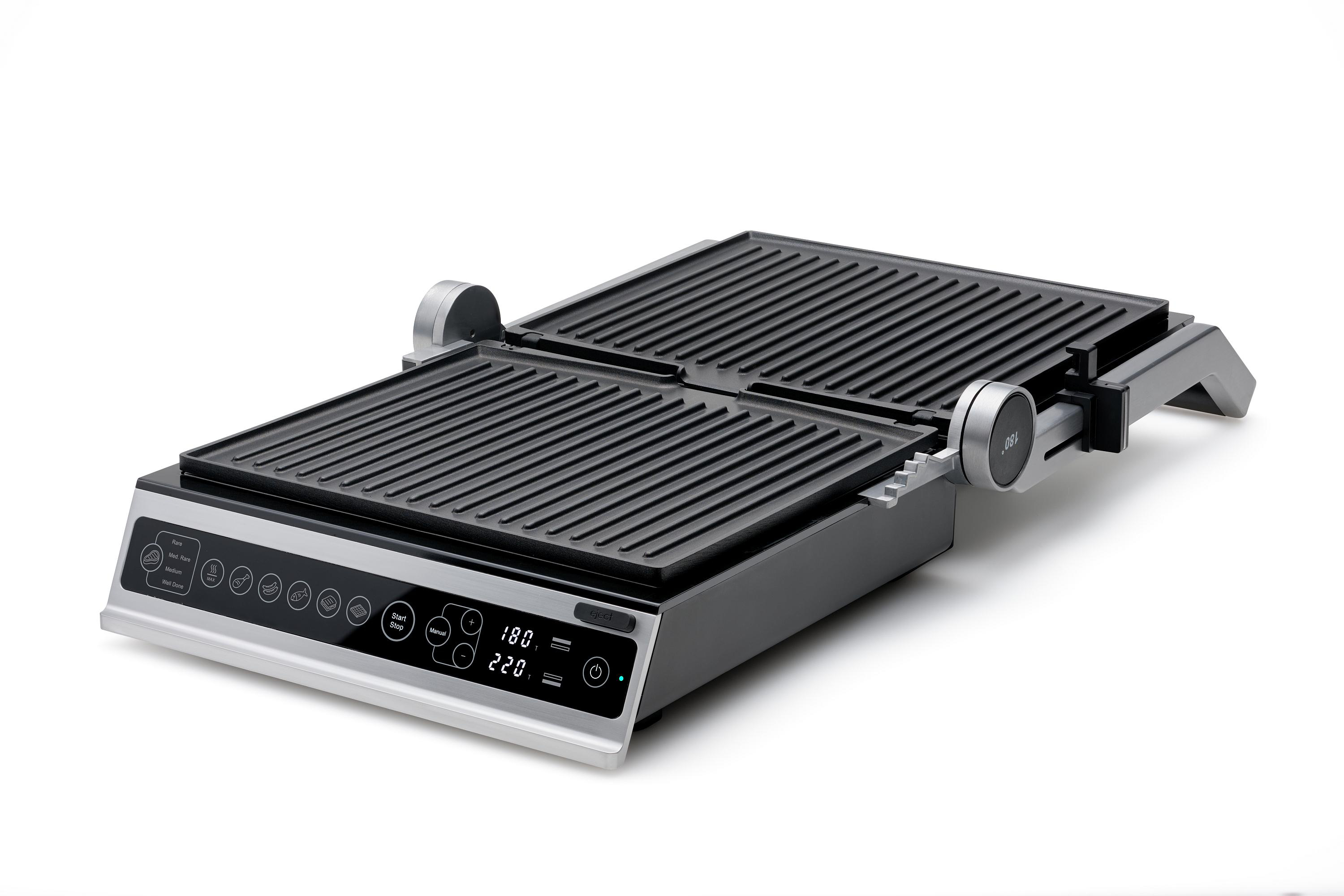 Ein geschlossener, silber-schwarzer Grill. Auf weißer Oberfläche, Knöpfe und Display vorne.