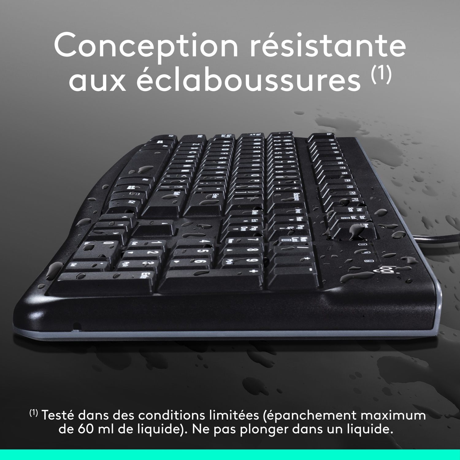 A black keyboard with water droplets.
