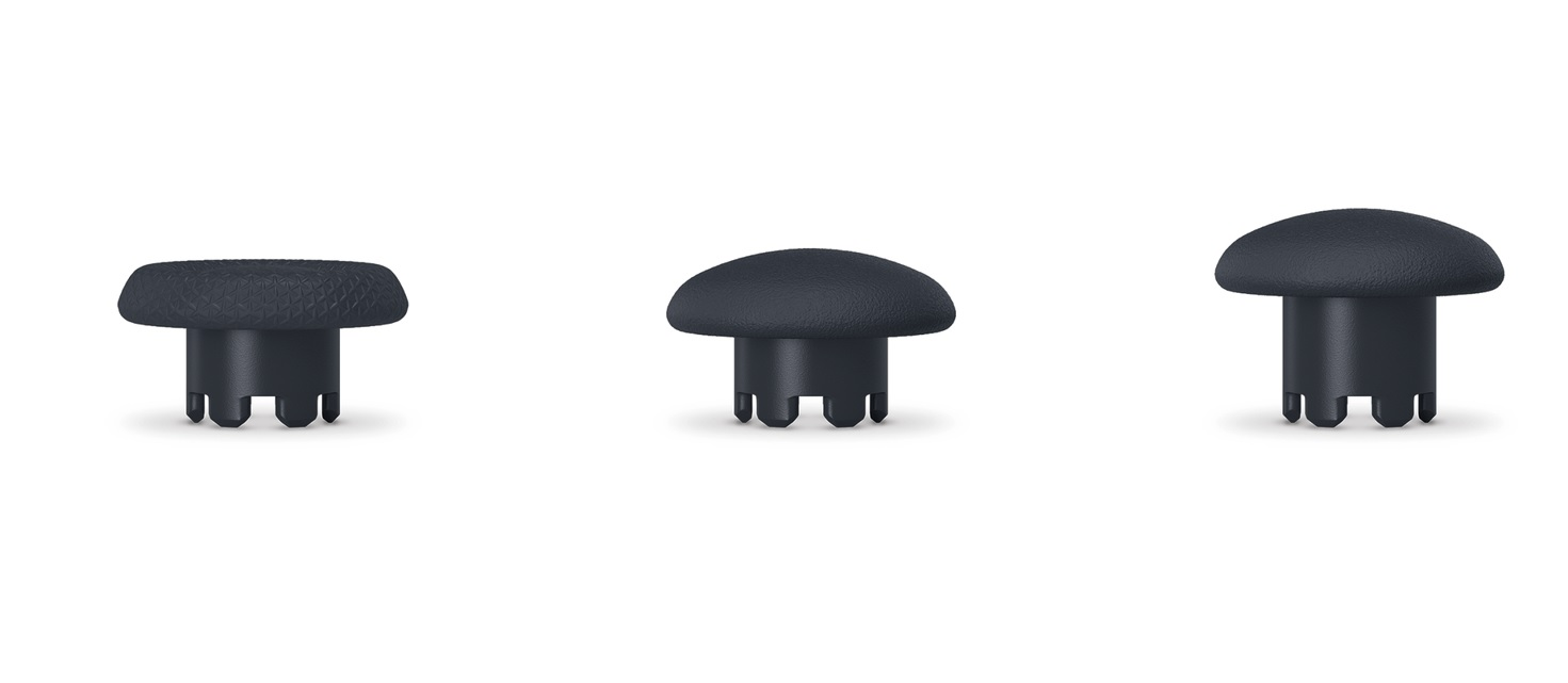 Trzy czarne gałki joysticka na białym tle, każda o innej fakturze.