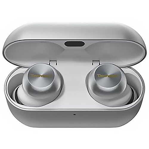 Szare etui na słuchawki, otwarte. Wewnątrz dwa srebrne słuchawki ze złotym napisem.