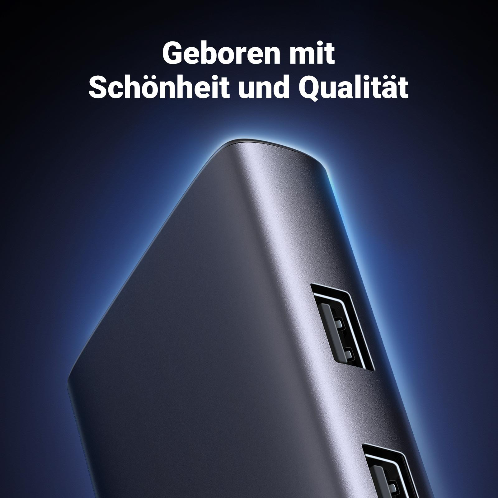 Ein schwarzer USB-Hub mit Anschlüssen, der einen Satz auf Deutsch hat.