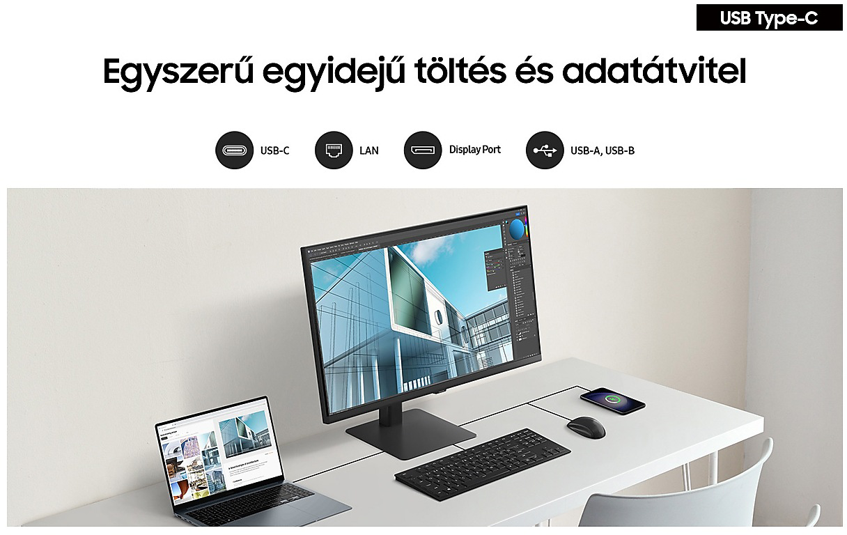 Egy asztal monitorral, laptoppal, billentyűzettel, egérrel és telefonnal. A monitor tervezőszoftvert mutat.