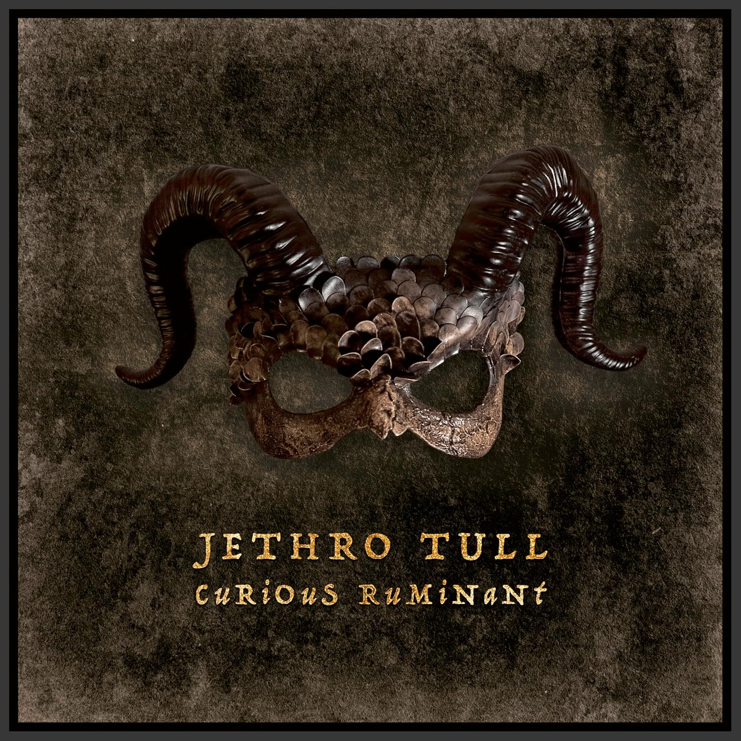 Jethro Tull album borító, szarvakkal ellátott maszkkal és 'Curious Ruminant' szöveggel.