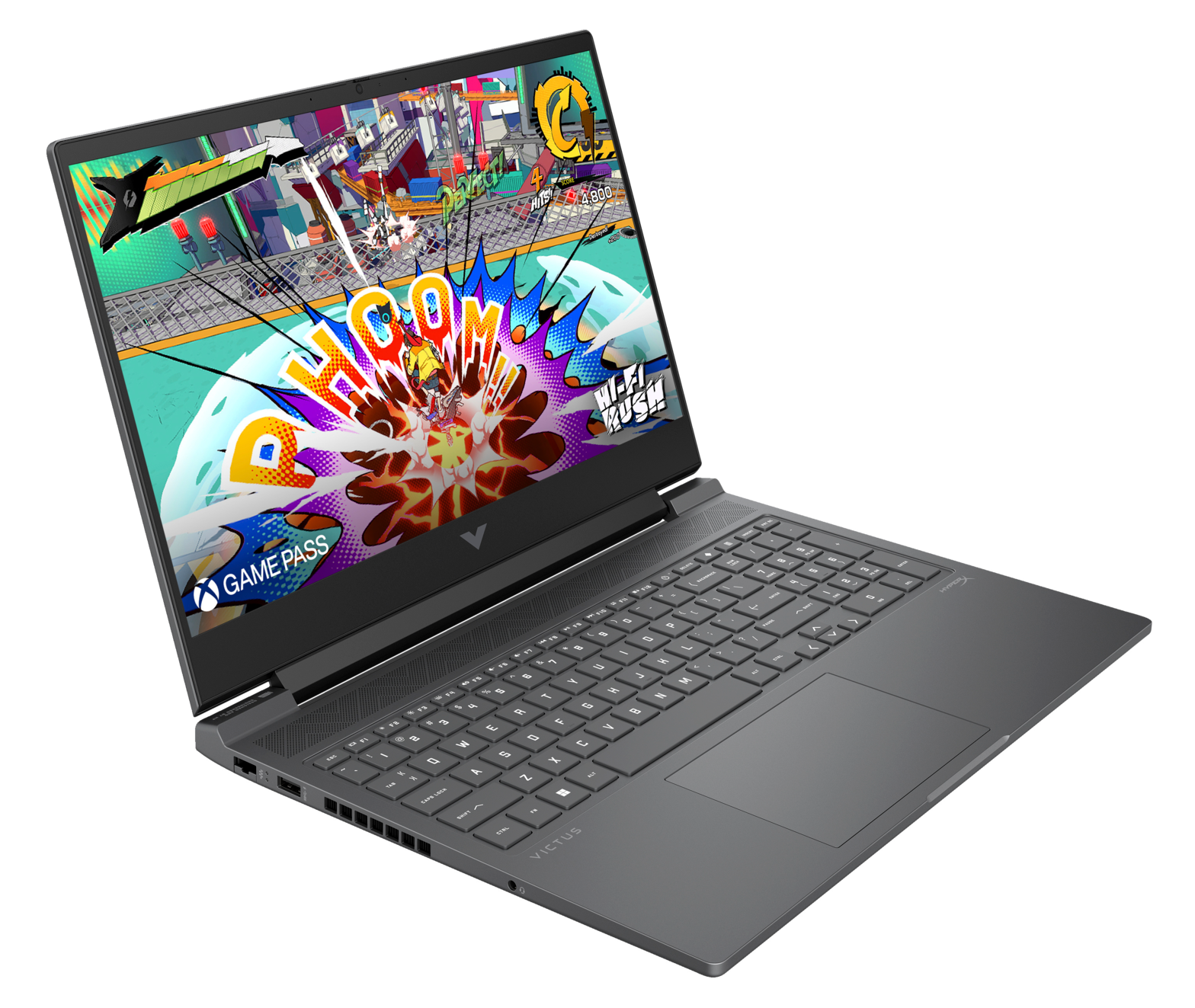 Laptop z grą na ekranie. Kolorowa grafika, klawiatura i gładzik widoczne.