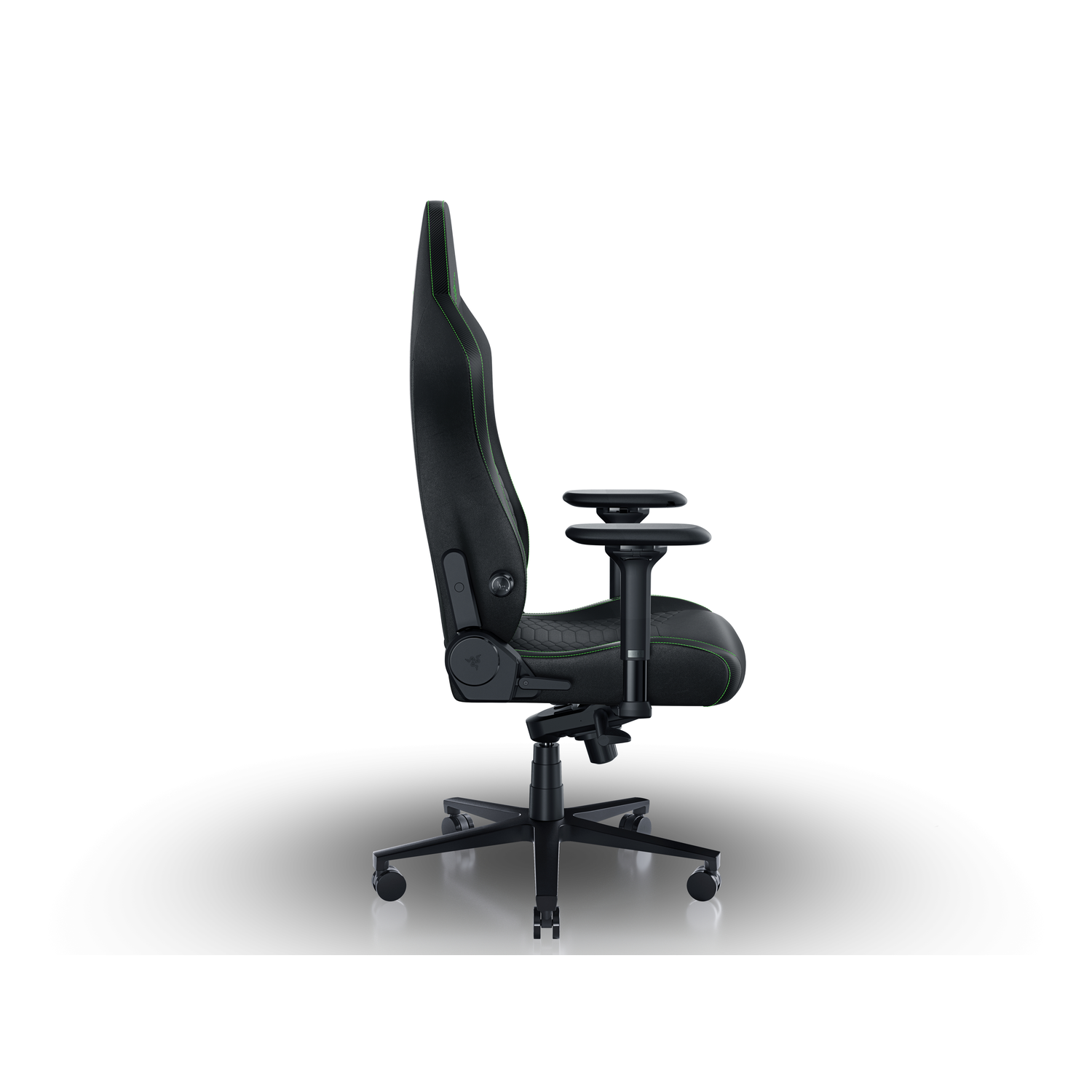 A black gaming chair with green stitching.