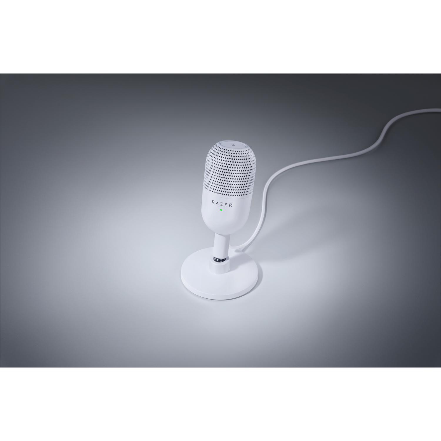White microphone on a white stand against a gray background. It has a mesh top and a cable.