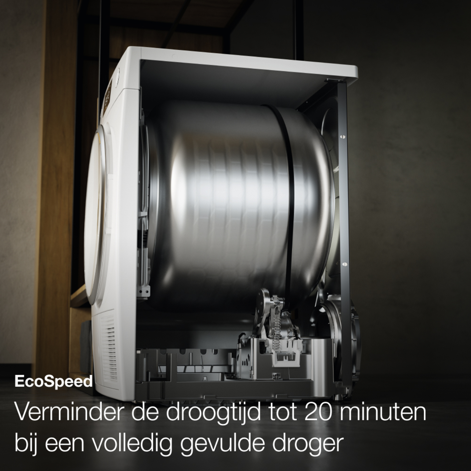 Dryer interior view. Metal drum with writing. Text: 'Reduce drying time by 20 minutes'.