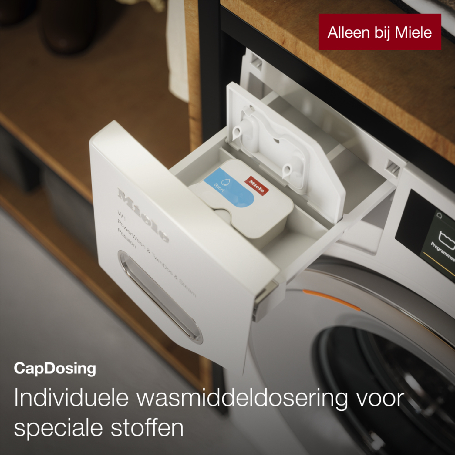 White washing machine with a detergent dispenser, the drawer is open. Text says 'Miele'