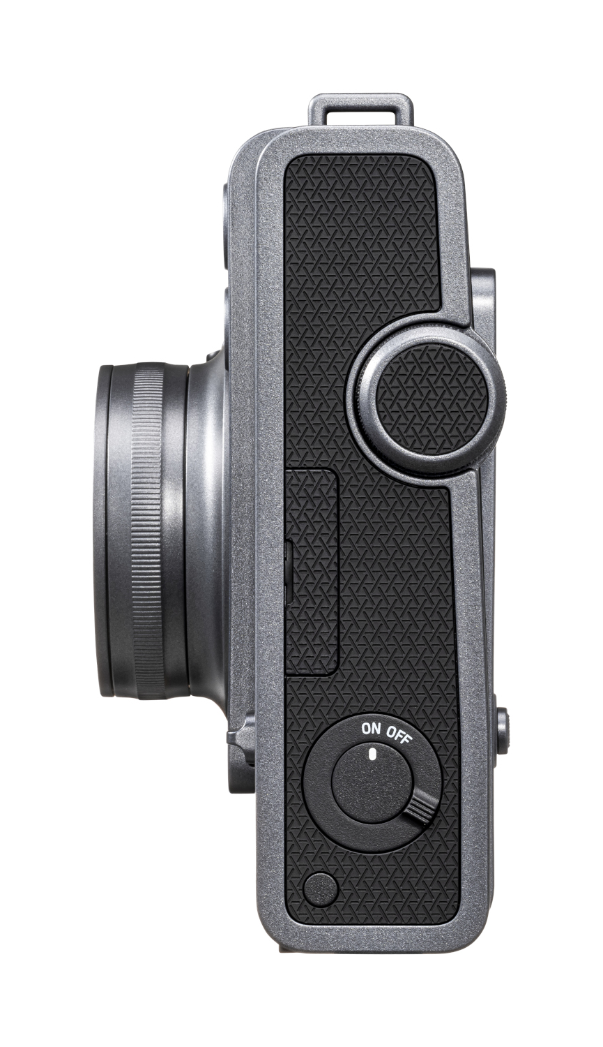 Side view of a grey camera with lens and buttons, isolated.