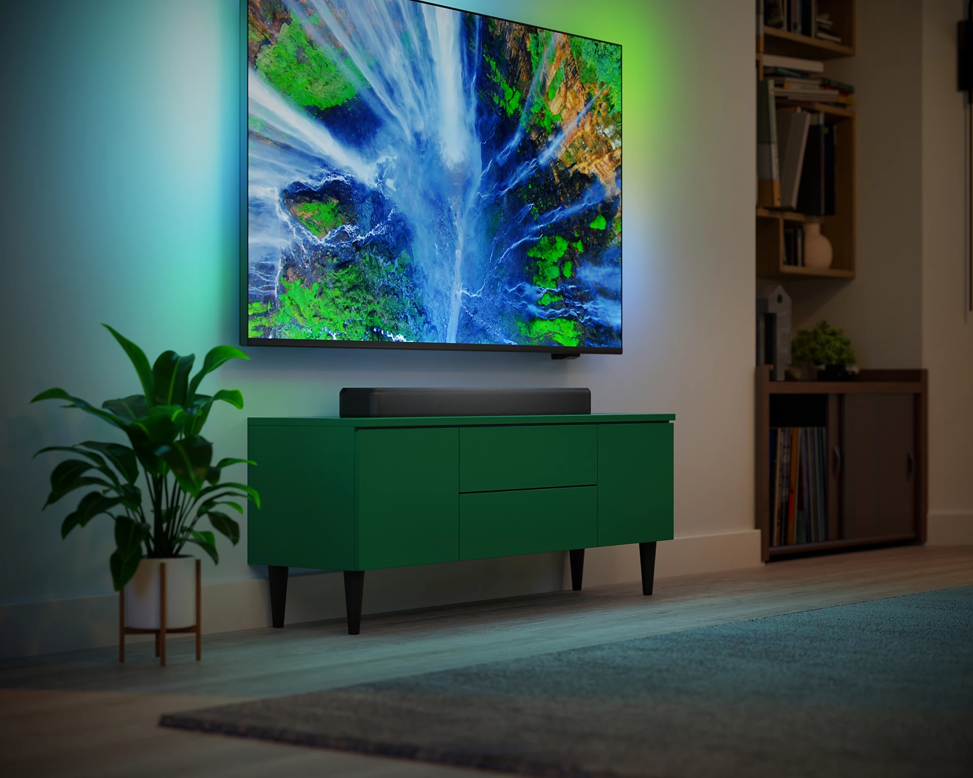 Salón con TV, mueble verde, luces ambientales verdes y azules.