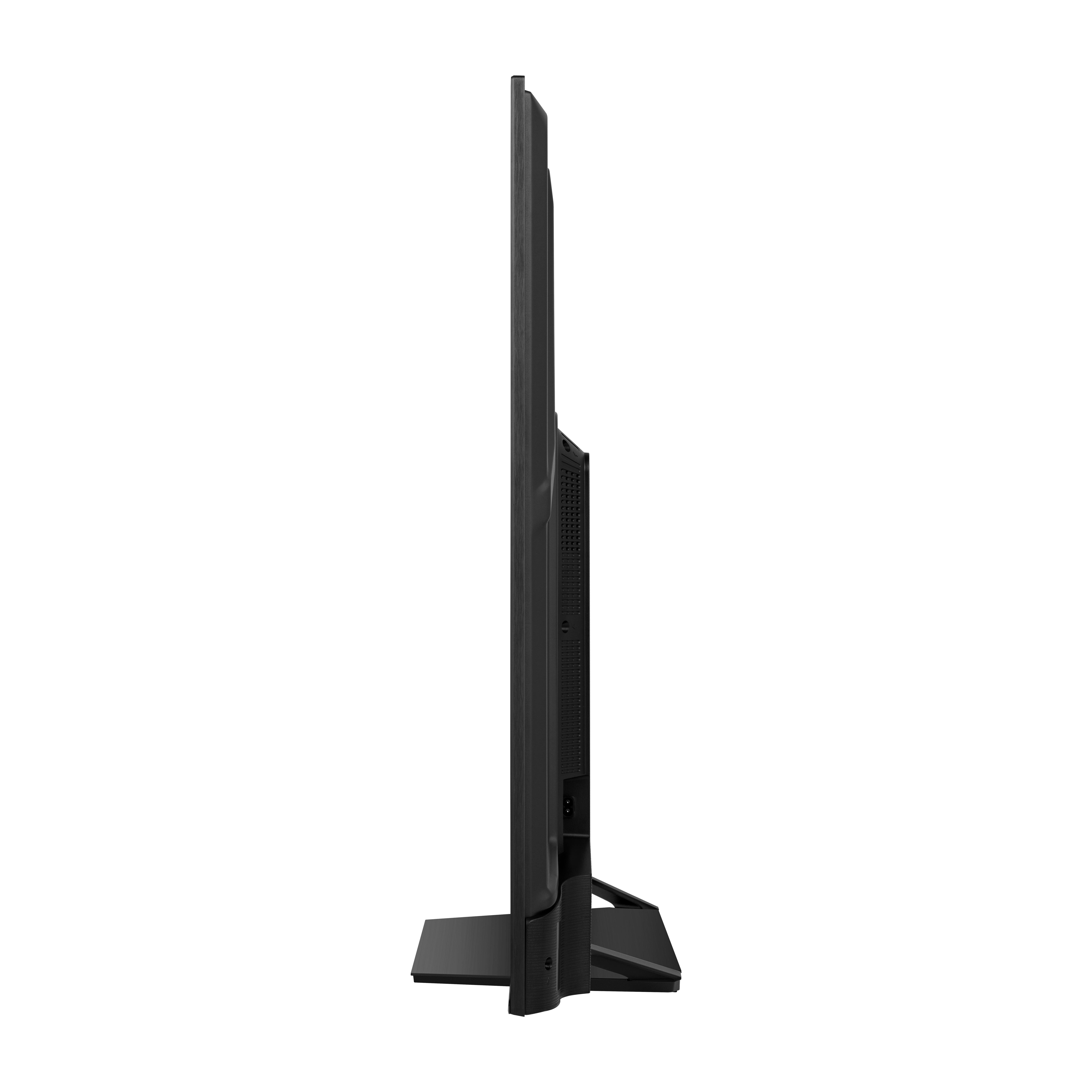 Seitenansicht eines schwarzen Fernsehers auf einem Ständer, der das schlanke Profil zeigt.