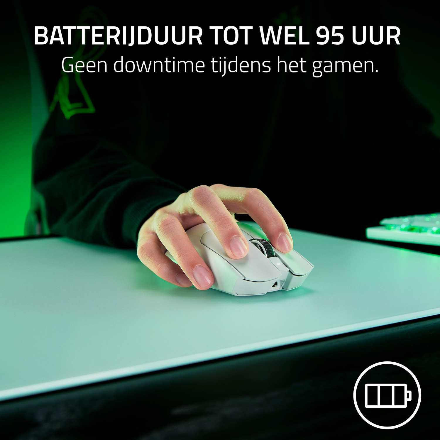 Person using a white mouse on a white mousepad. Battery life graphic is visible.