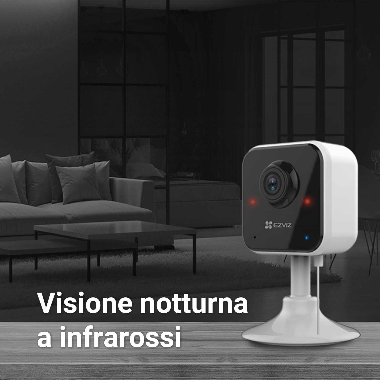 Una telecamera di sicurezza bianca in una stanza buia. Luci rosse e blu visibili.