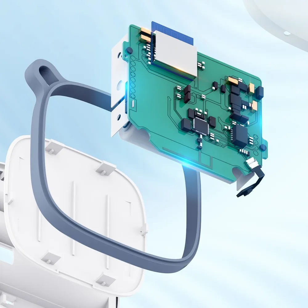 Widok wewnętrzny urządzenia z zieloną płytką drukowaną i niebiesko-białą obudową.