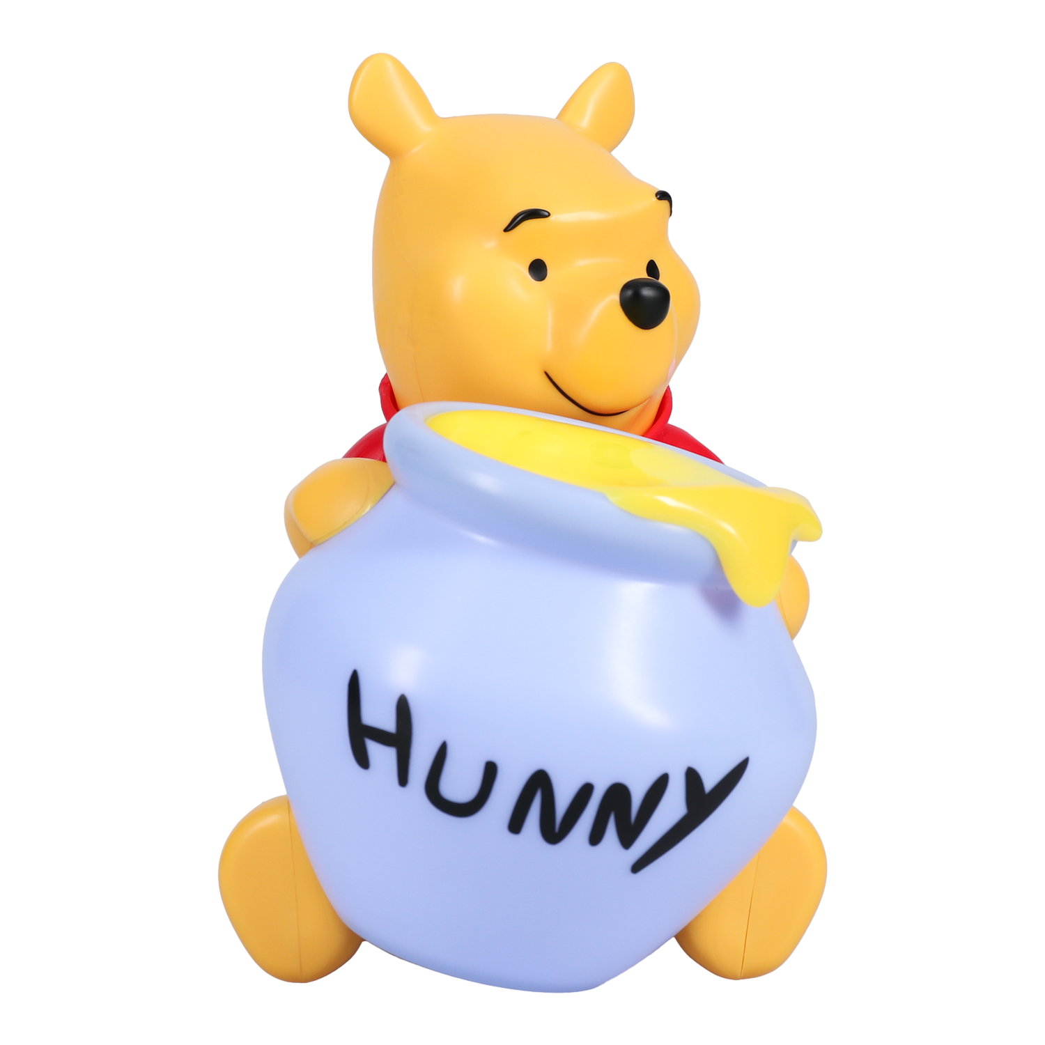 Winnie l'Ourson tenant un pot bleu avec 'Hunny' écrit dessus. Il est assis.