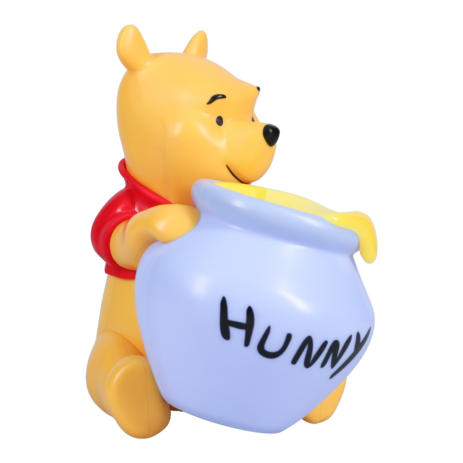 Une figurine jaune de Winnie l'ourson tenant un pot de miel bleu. Le pot porte le mot "HUNNY".