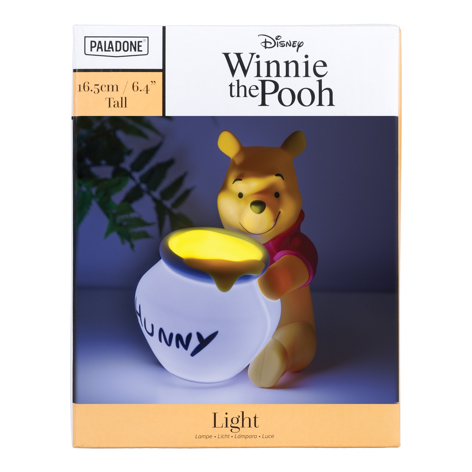 Lampe Winnie l'Ourson dans une boîte, avec une lumière sur le pot de miel.