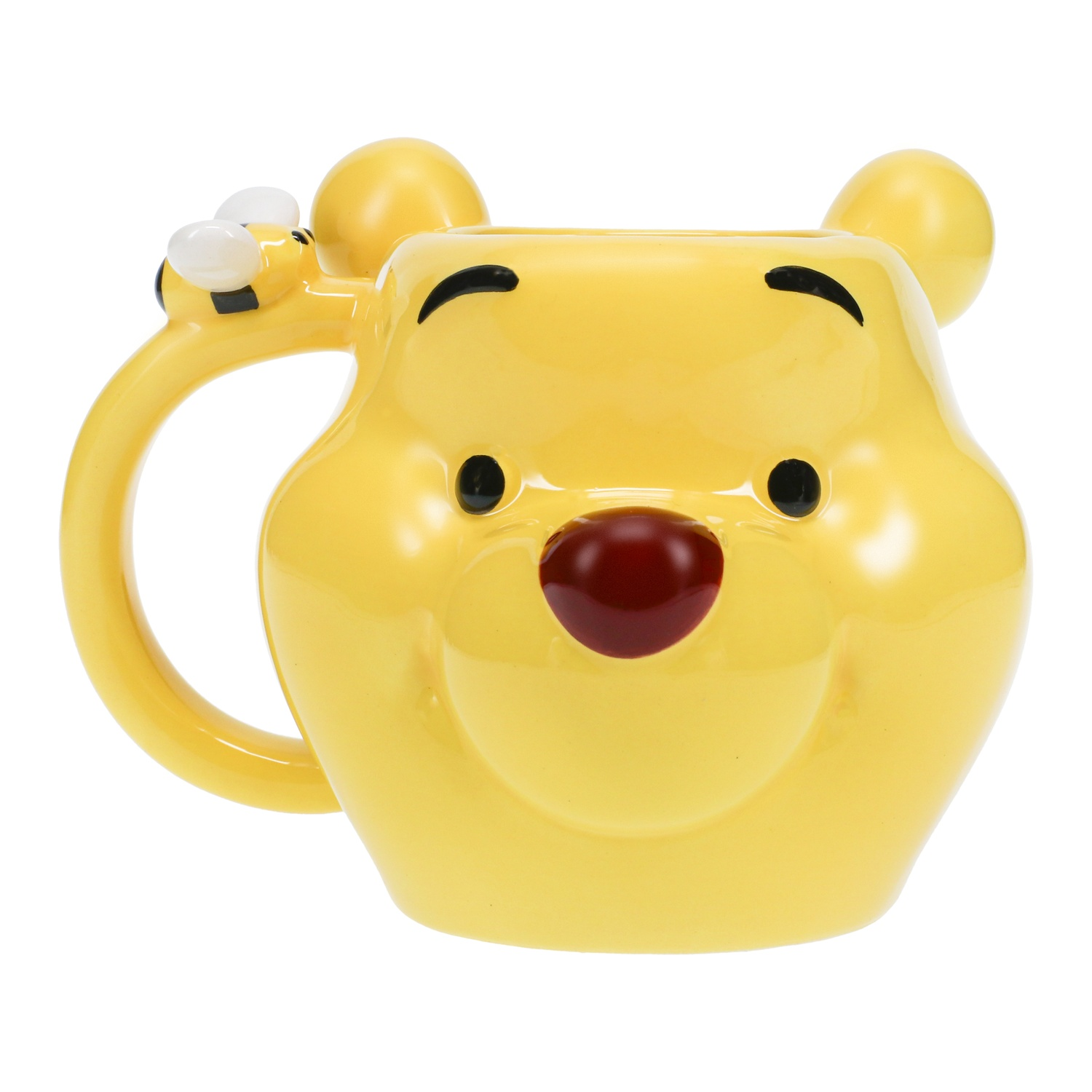 A yellow Winnie the Pooh mug with a smiling face, bear ears, and a bee on the handle against white.