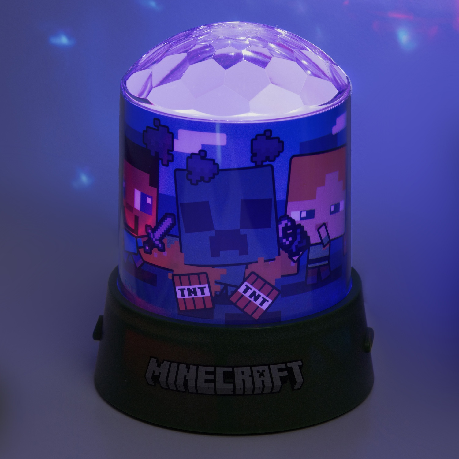 Minecraft-lamp met karakterafbeeldingen. De basis is zwart en de lamp heeft een draaiende, facetgeslepen bovenkant.