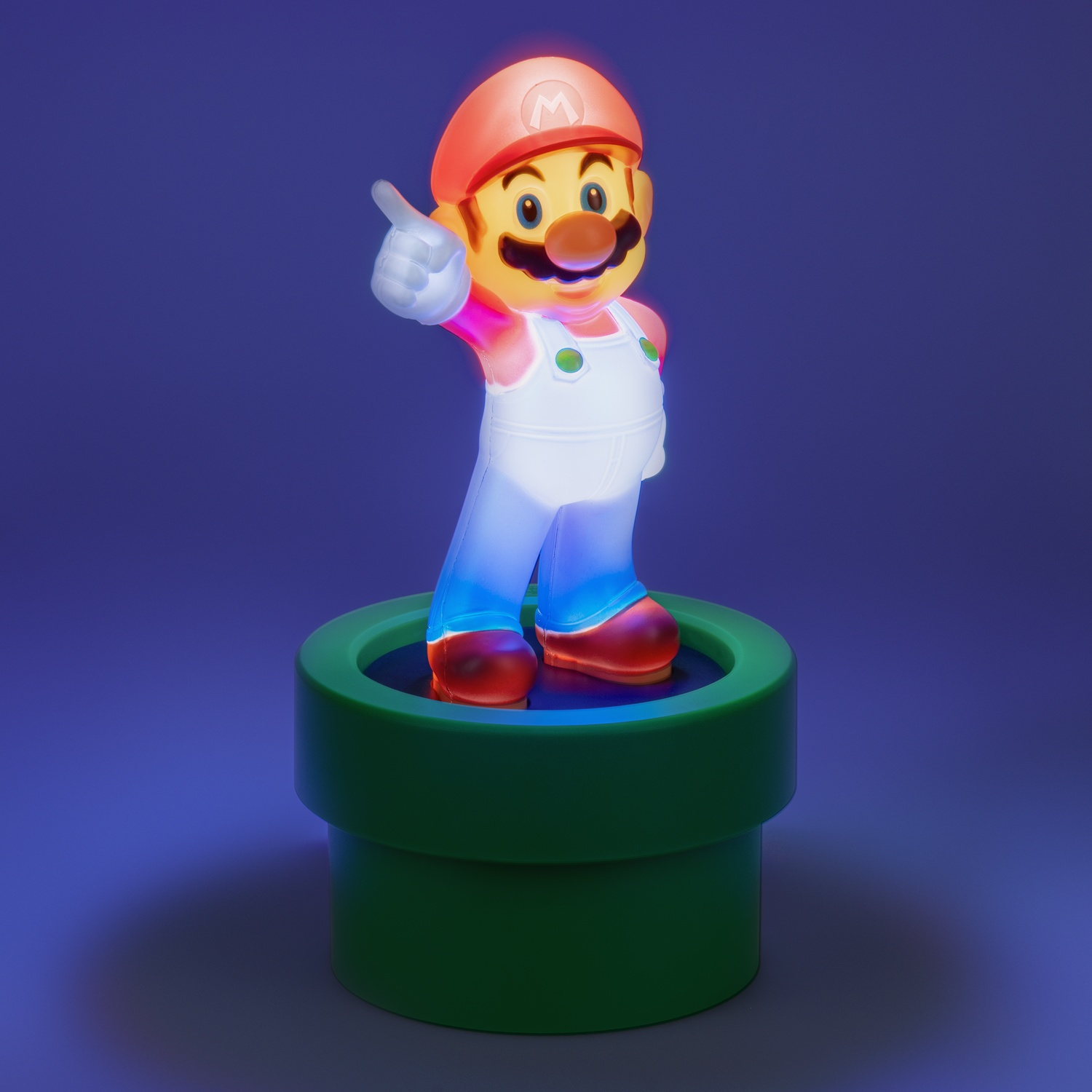 Mario figure on a green pipe base, giving a thumbs up, illuminated with blue and red light.
