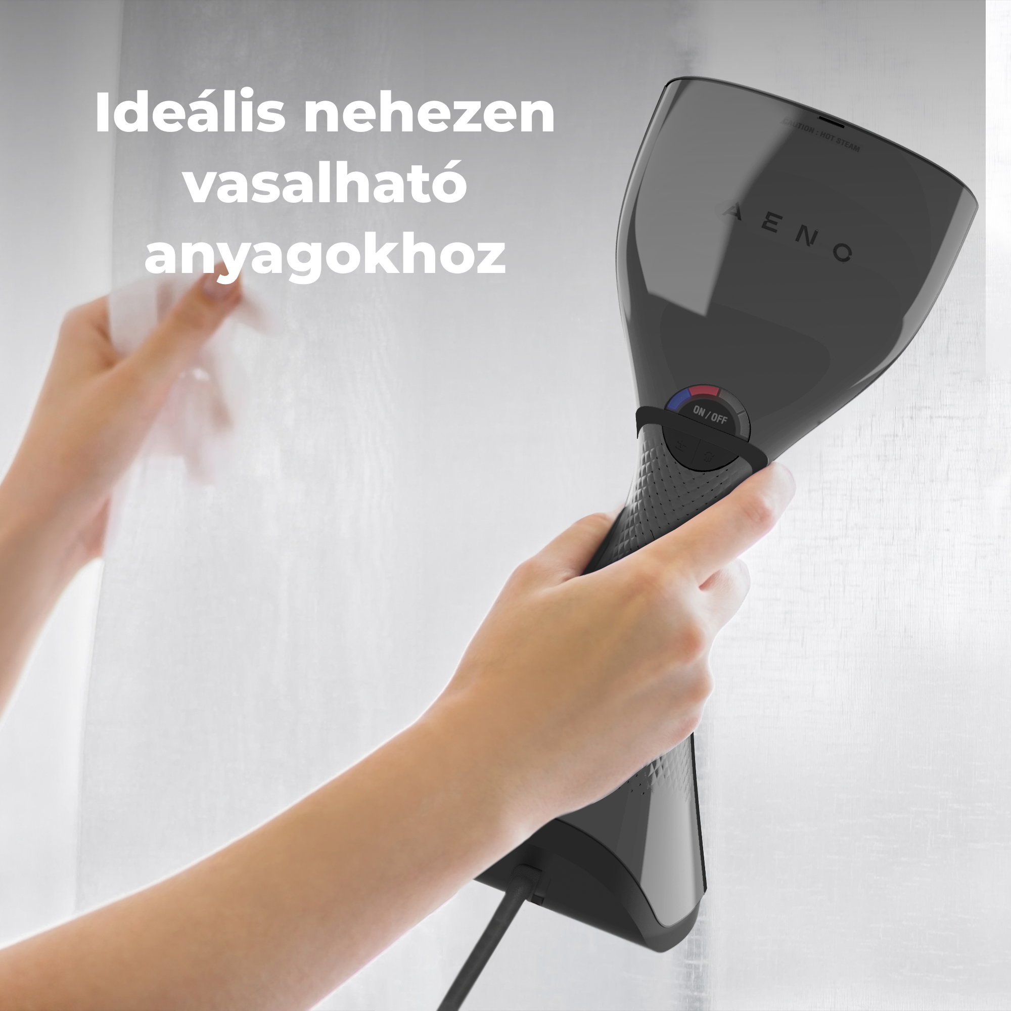 Kézben tartott fekete ruhagőzölő, fehér anyagot gőzöl.