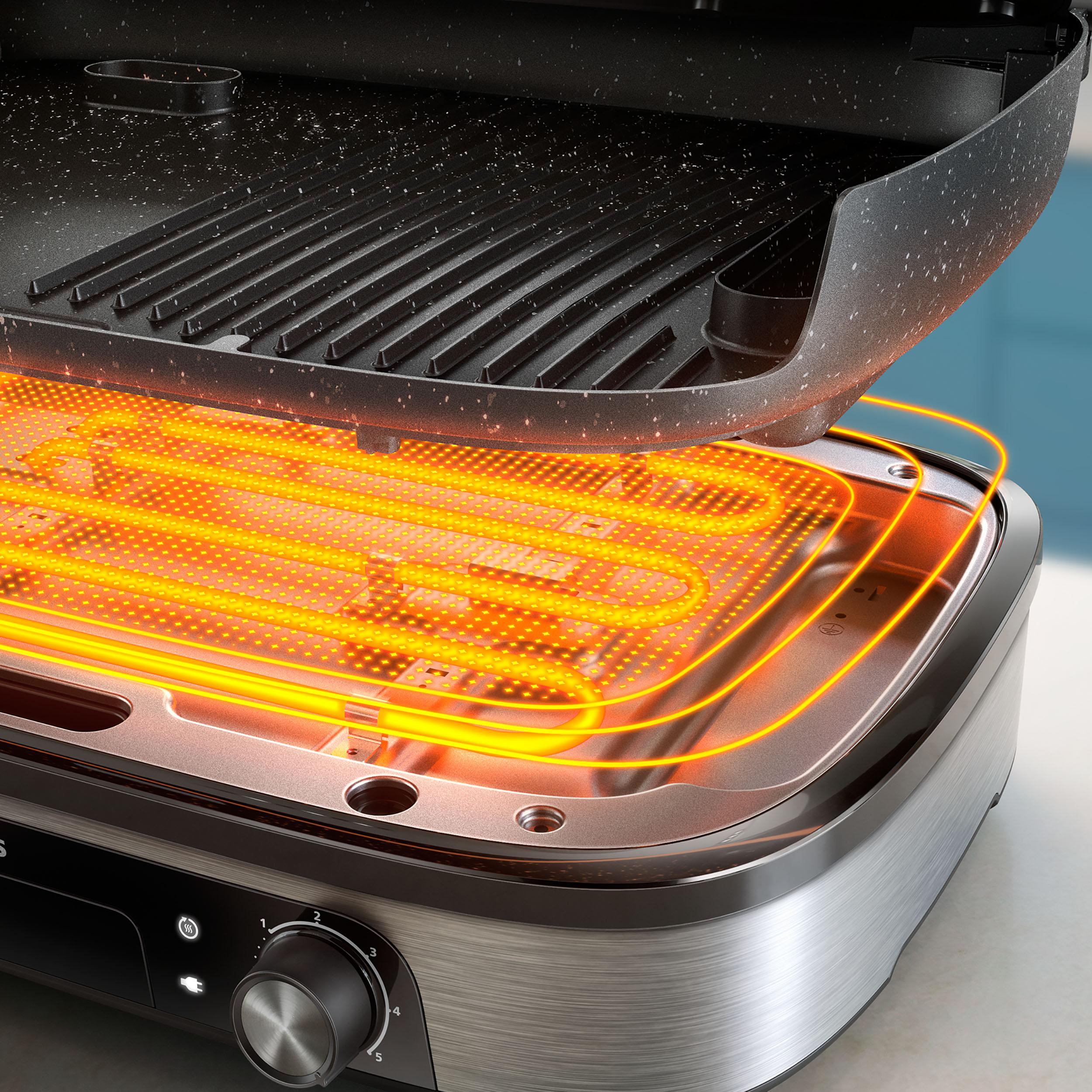 Ein Grill mit erhitzter Oberfläche, orangefarben leuchtend.