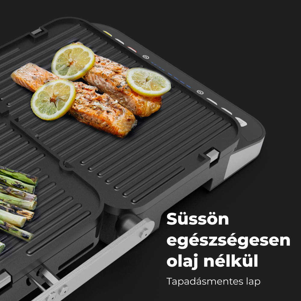 Egy fekete grill sült lazaccal és citromszeletekkel. Spárga is van a grillen, mind fekete felületen.