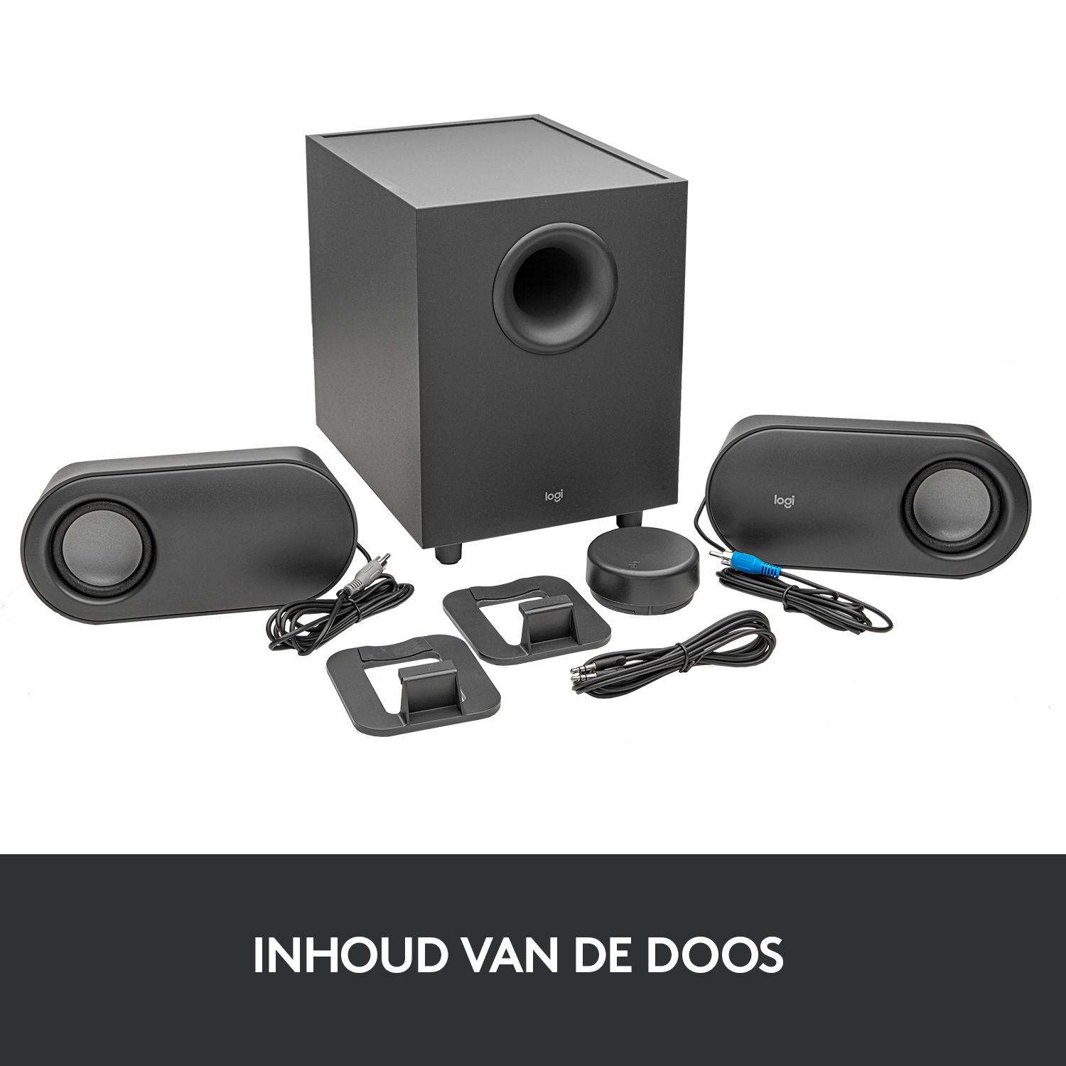 Een zwart 2.1 Logi-luidsprekersysteem, subwoofer en accessoires op een wit oppervlak.