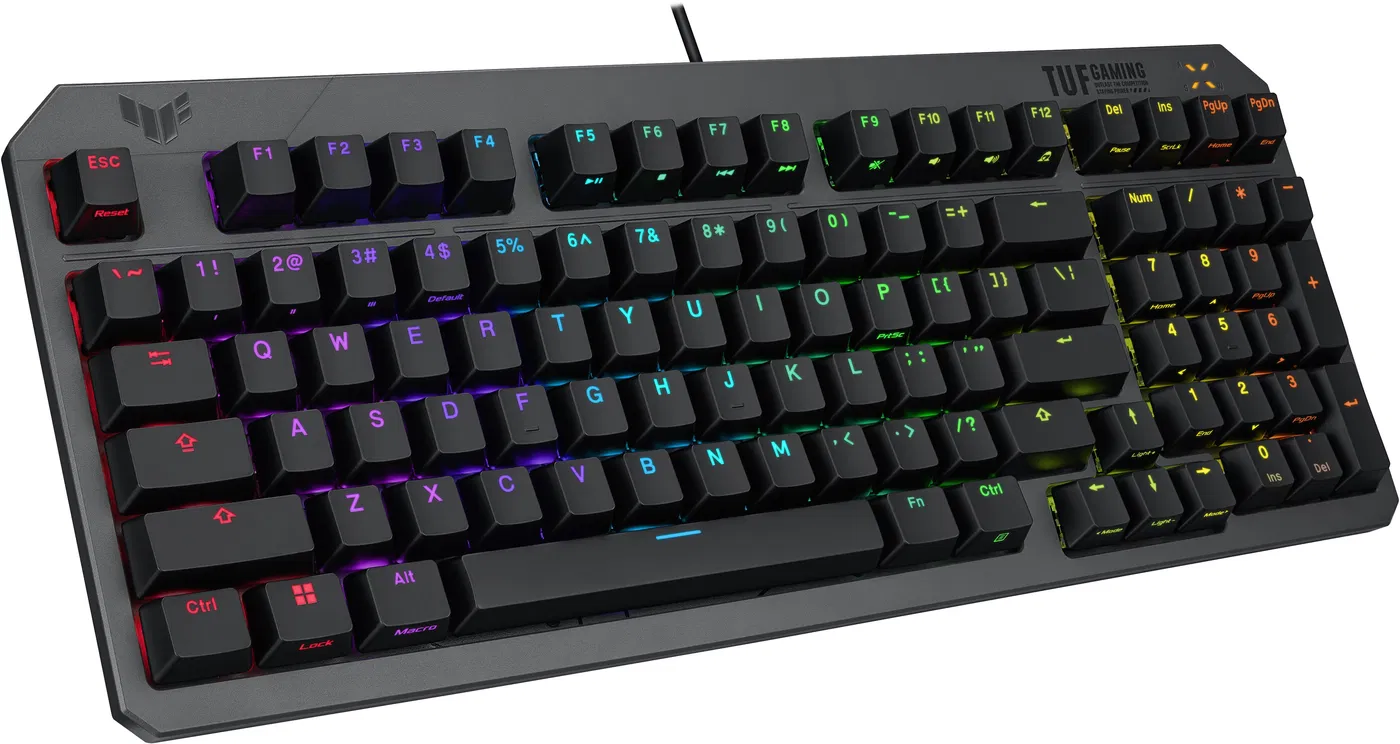 Fekete gamer billentyűzet többszínű gombokkal. TUF GAMING logó a jobb felső sarokban.