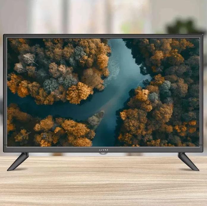 Czarny telewizor na stojaku, widok na las i rzekę.