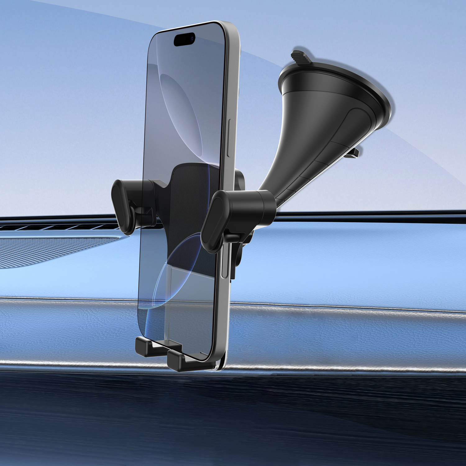 A phone in a black car mount on a blue dashboard with a windshield.