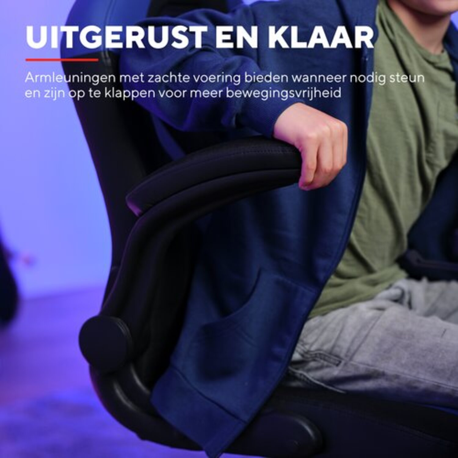 Close-up of a blue jacketed arm resting on a black gaming chair armrest. Blue accent. Text: cushioned armrests.